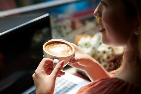 woman drinking latte