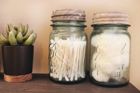 glass jars used in bathroom for organization | Lelior Blog