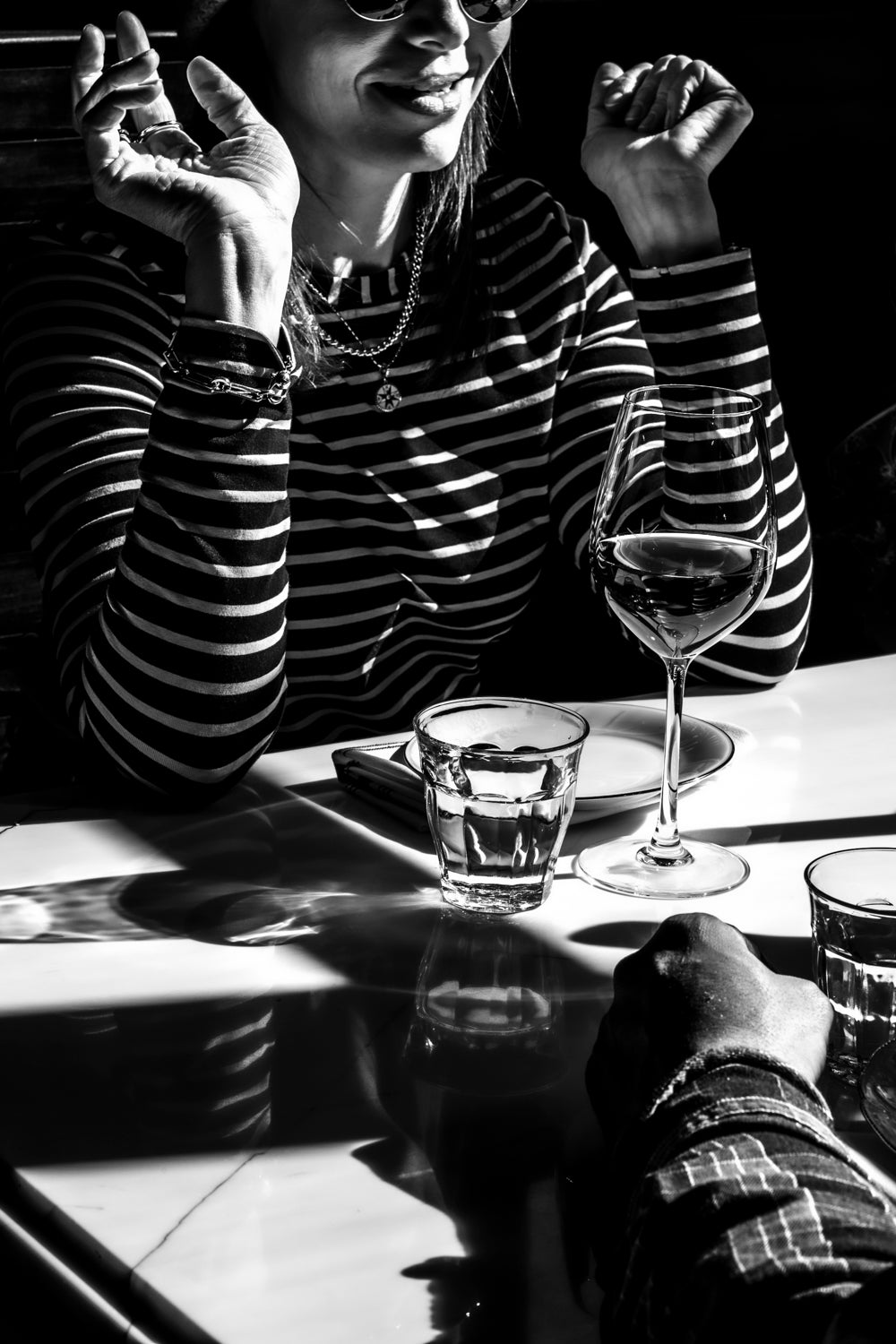 Black and white table with a glass of wine
