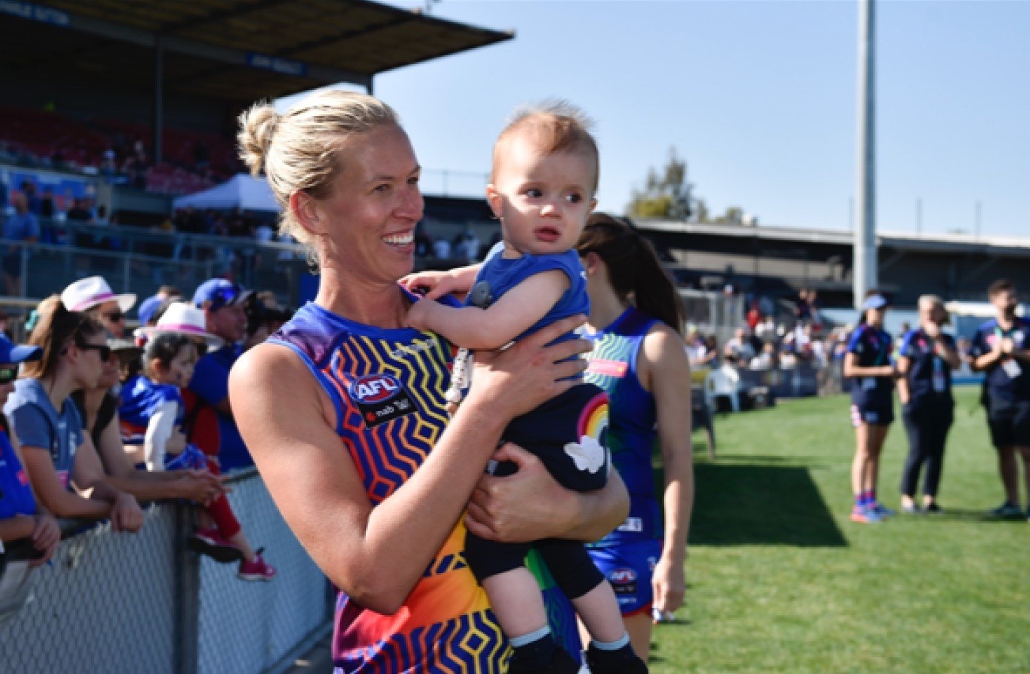 Lauren with her nephew playing AFLW