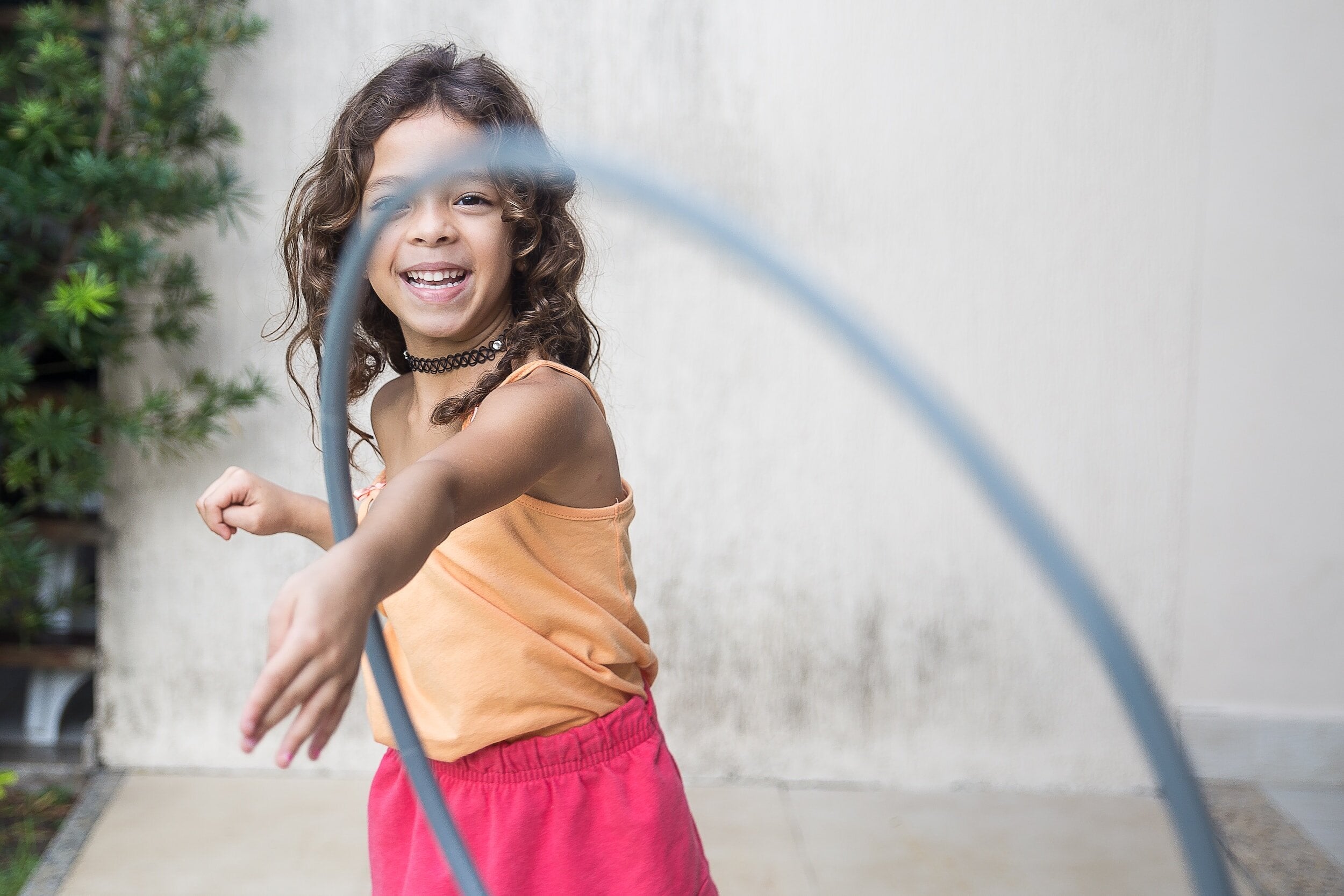 Girl throwing a hula hoop