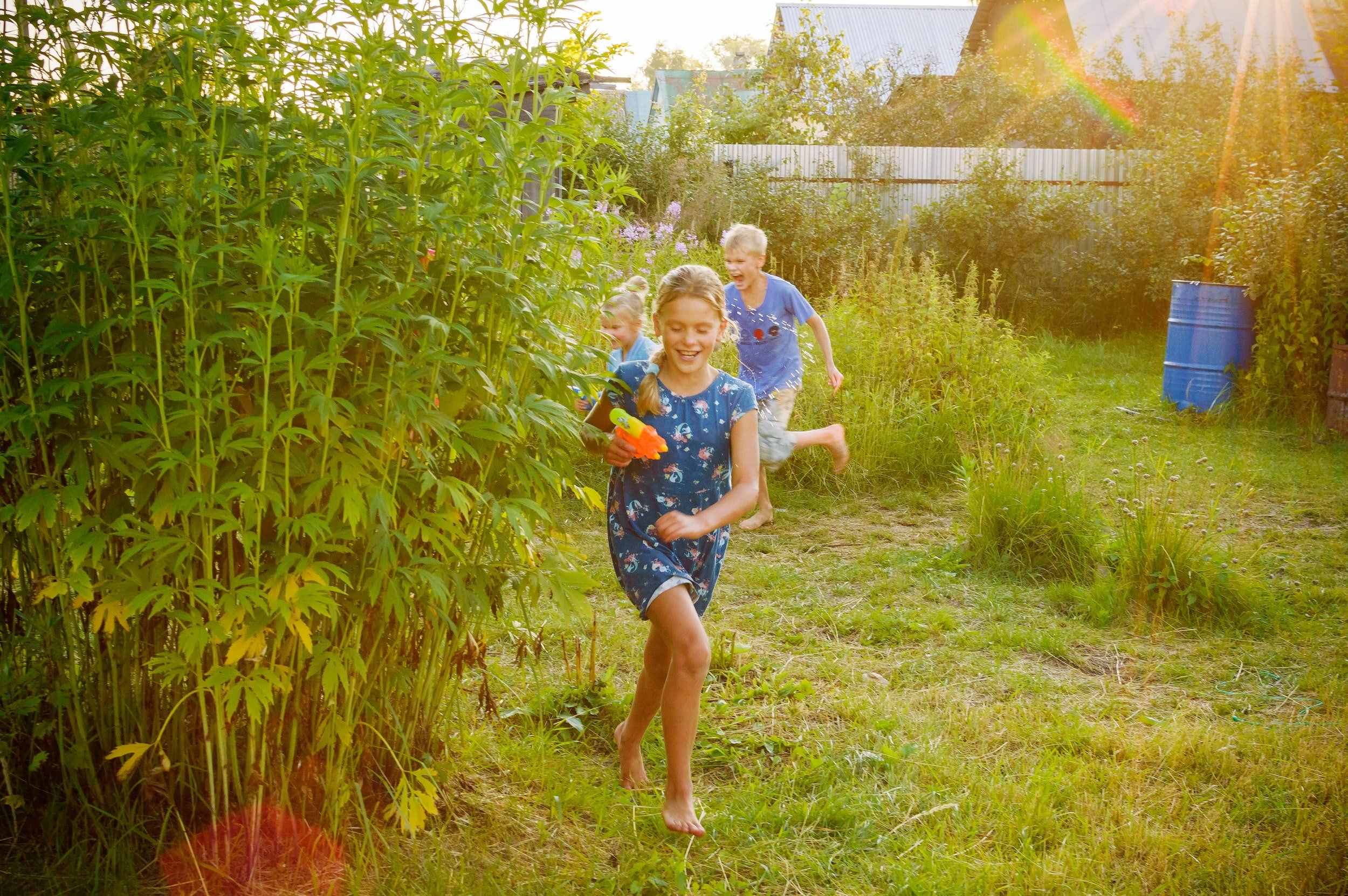 children running through a field