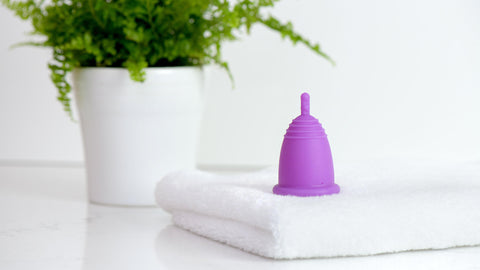 menstrual cup sitting on a bathroom counter