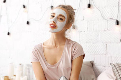 woman with Pumpkin Facial Mask with Fruit Enzymes white cream applied to her face