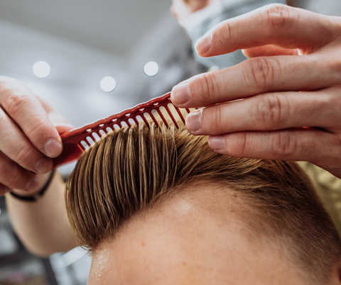 man combing his hair