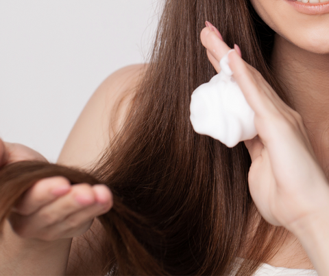 adding conditioner on hair