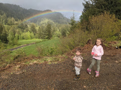 2 kids underneath the rainbow