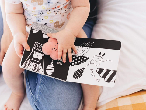 Child-Holding-10-Little-Kisses-Black-and-White-Board-Book-Naked-Baby-Eco-Boutique