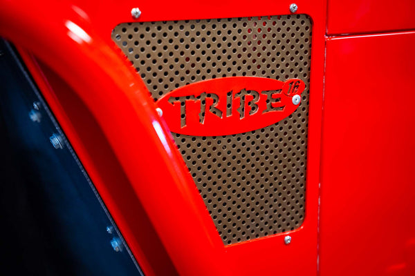 red and bronze accent on a jeep with custom tribe logo