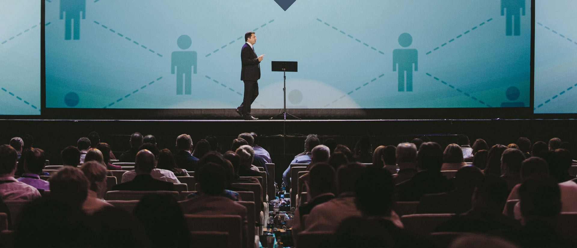 Dr. Henry Cloud walking on stage