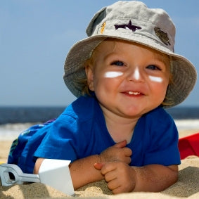 Baby with sunscreen to face