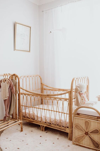 Baby bedroom featuring cane furniture