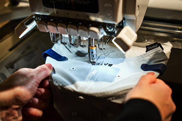 Cap being embroidered