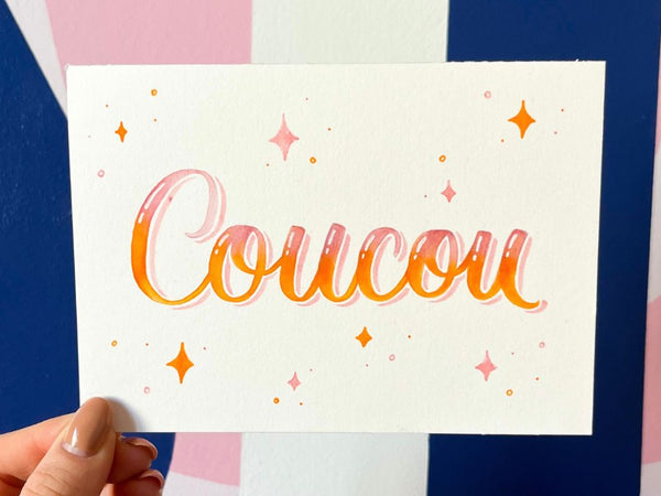 Le mot "coucou" écrit en brushlettering