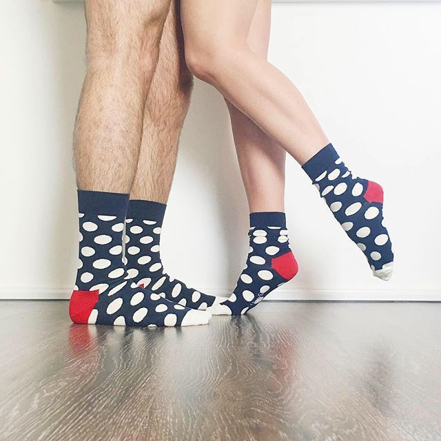 A picture of models wearing happy socks to show that Happy socks gift boxes are great for both him and her