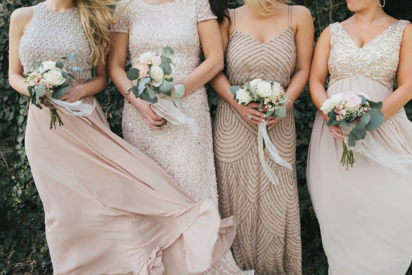 4 Brides Holding Different types of flowers or bouquets, showcasing various styles