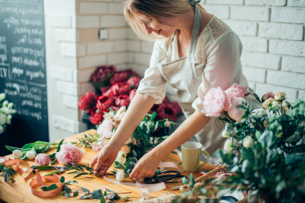 Smiling Florist Arranging Plants Flower Shop