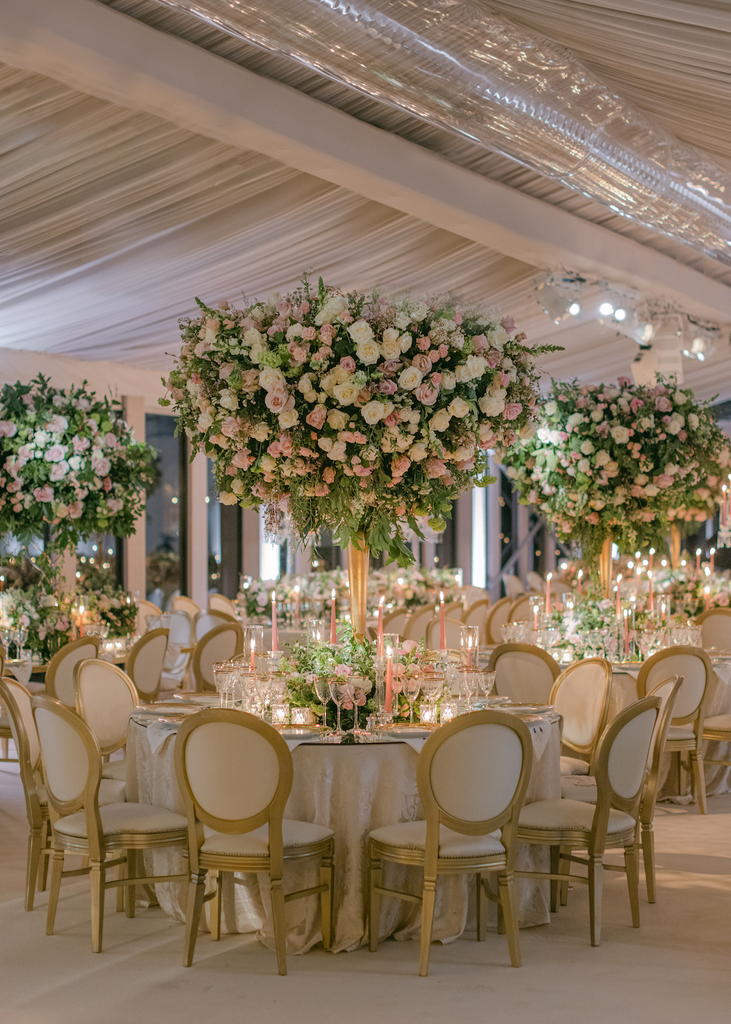 A photo of a beautifully decorated wedding venue with flowers that complement the theme and colour scheme