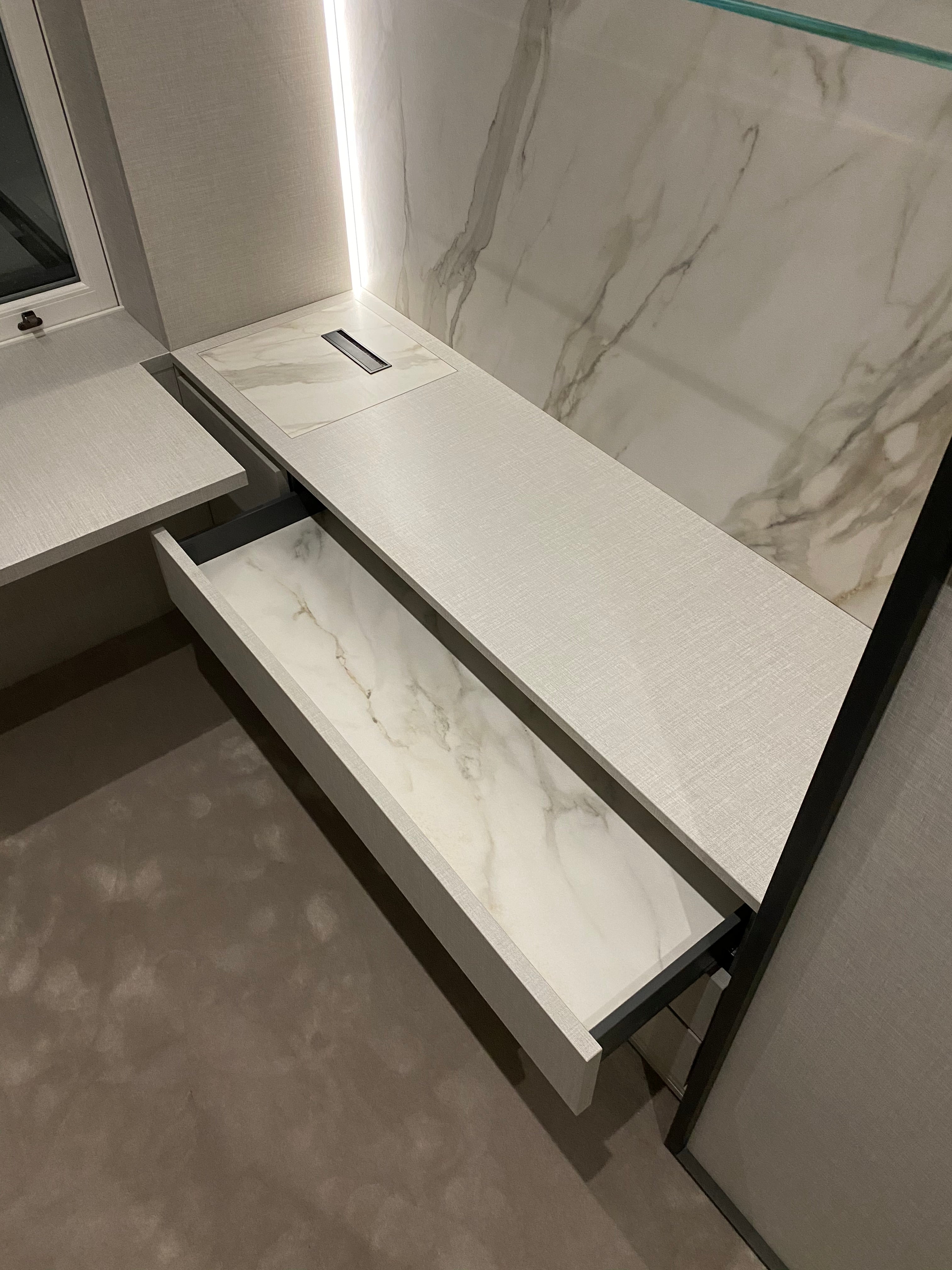 Large format porcelain integrated into bespoke furniture