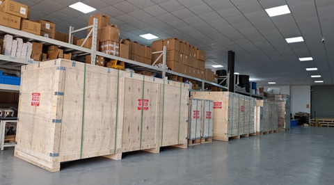 Rows of Hyperbaric Chambers in wooden crates in a warehouse
