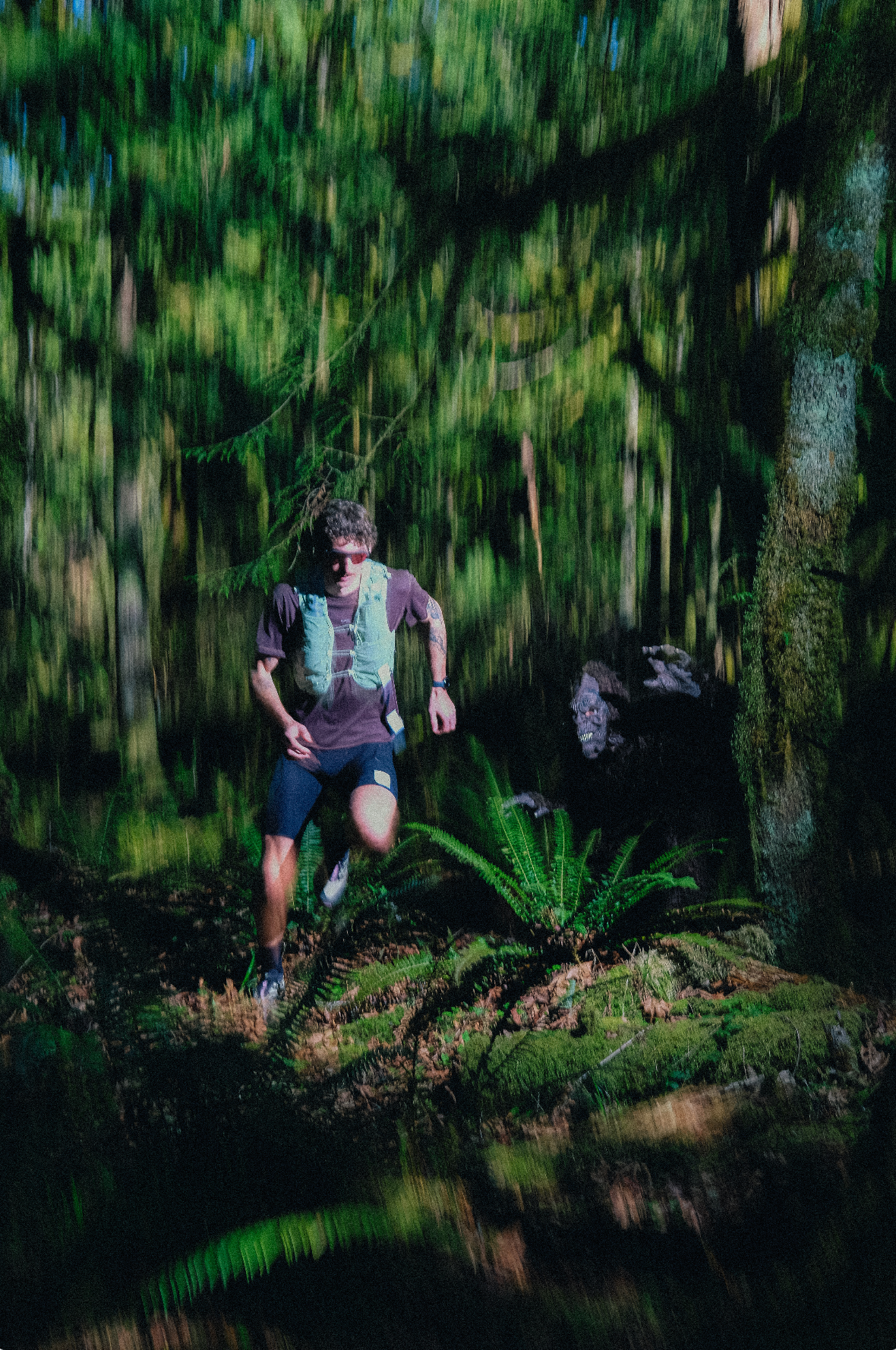 A man running in Satisfy from a lurking Sasquatch