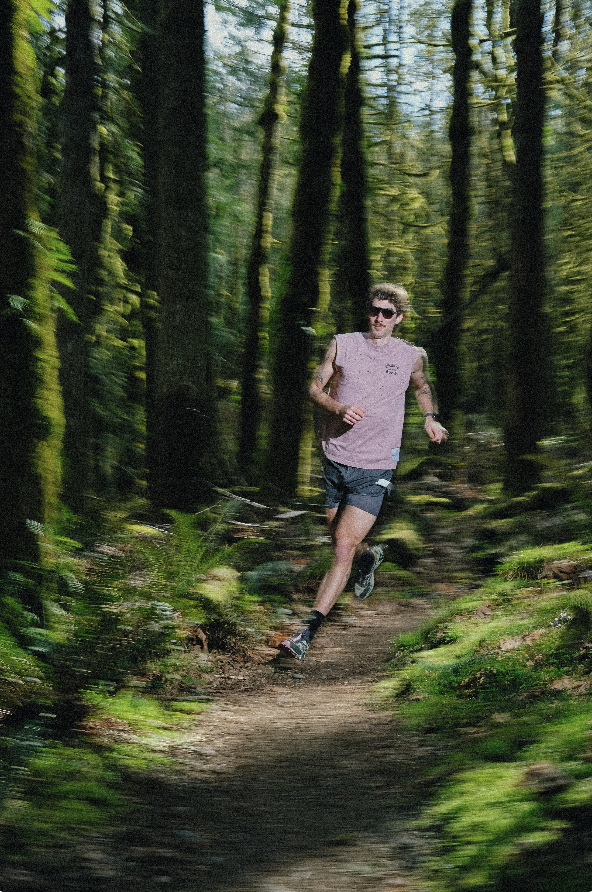 A man running in Satisfy through the woods