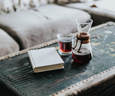 a pour over coffee maker with book