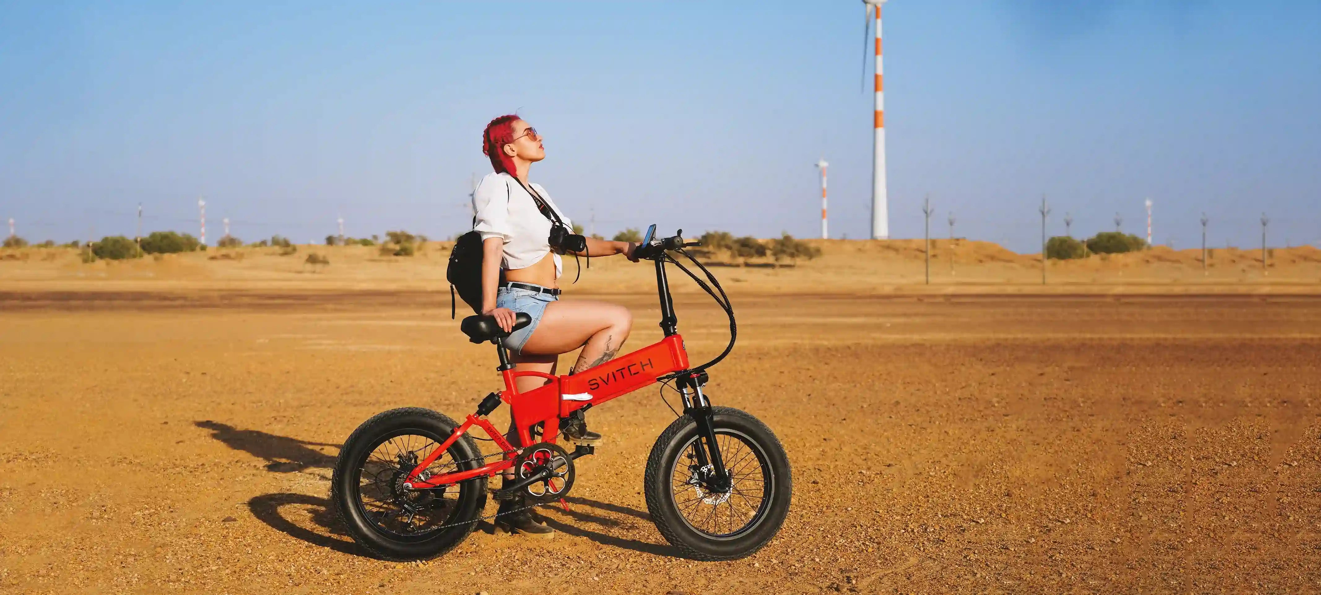 svitch red electric bike stand with girl