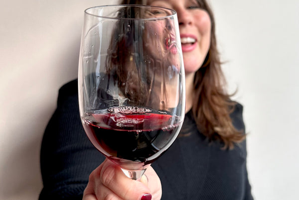 Classy lady holding a glass of red wine