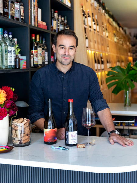 Chris Leon at the counter in his Clinton Hill, Brooklyn wine store
