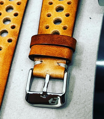 A vintage rallye-style leather watch strap with a textured surface and white stitching. This stylish and timeless accessory can complement any classic timepiece. Check out our collection of leather watch straps for luxury watches to find your perfect match.