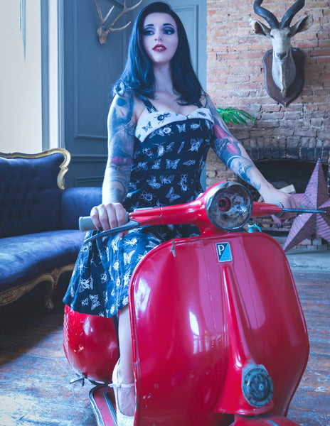 ivana hyde wearing a custom 8th sin dress, made of black and white fabric with insects on it, in rockabilly fashion style,featured in femme rebelle magazine, photographed by busha bailey