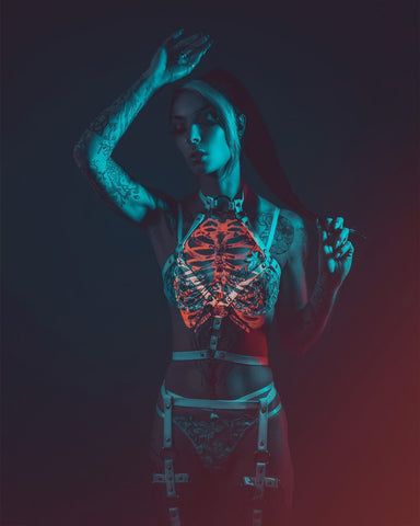 gel lighting with skeleton cast on tattooed model