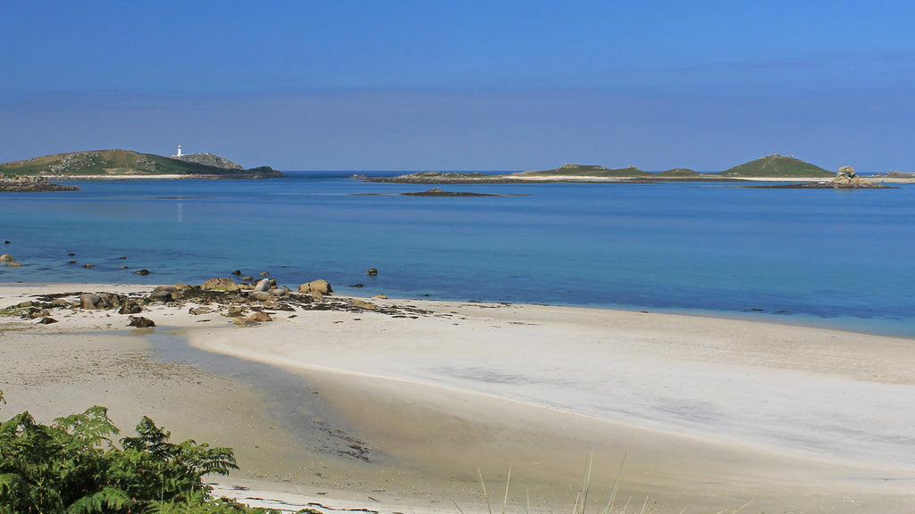 Looking over Treco beach to Round Island lighthouse, Isles of Scilly