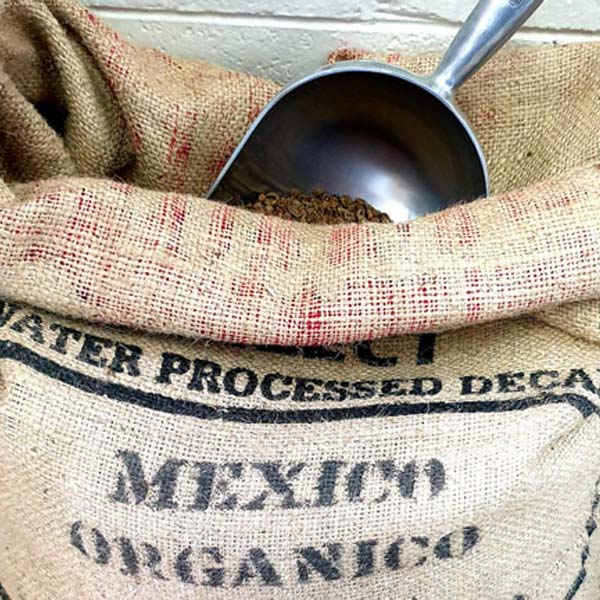 decaf organic coffee beans in coffee sack