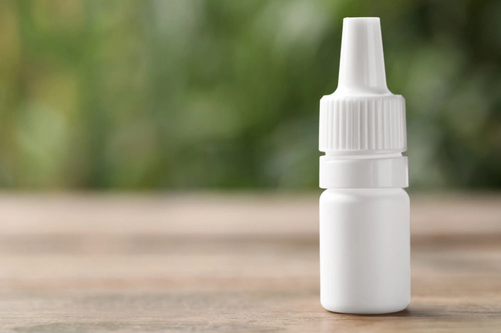 Vuity™ eye drop bottle containing pilocarpine hydrochloride 1.25% for presbyopia treatment, placed on wooden table