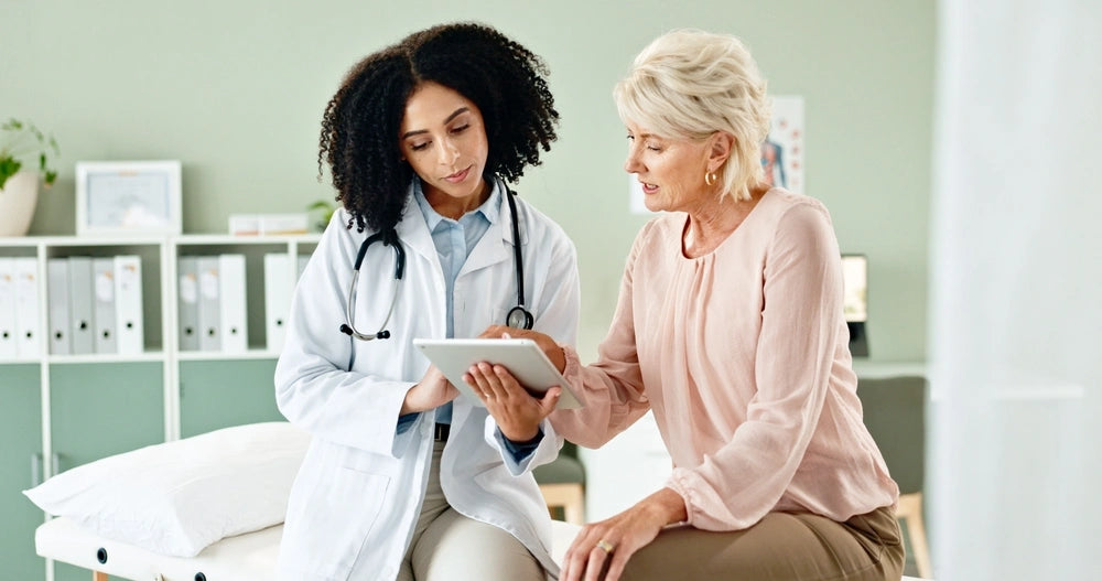 Doctor speaking with a patient, representing the importance of professional medical guidance in monitoring and managing side effects of Semaglutide treatment.