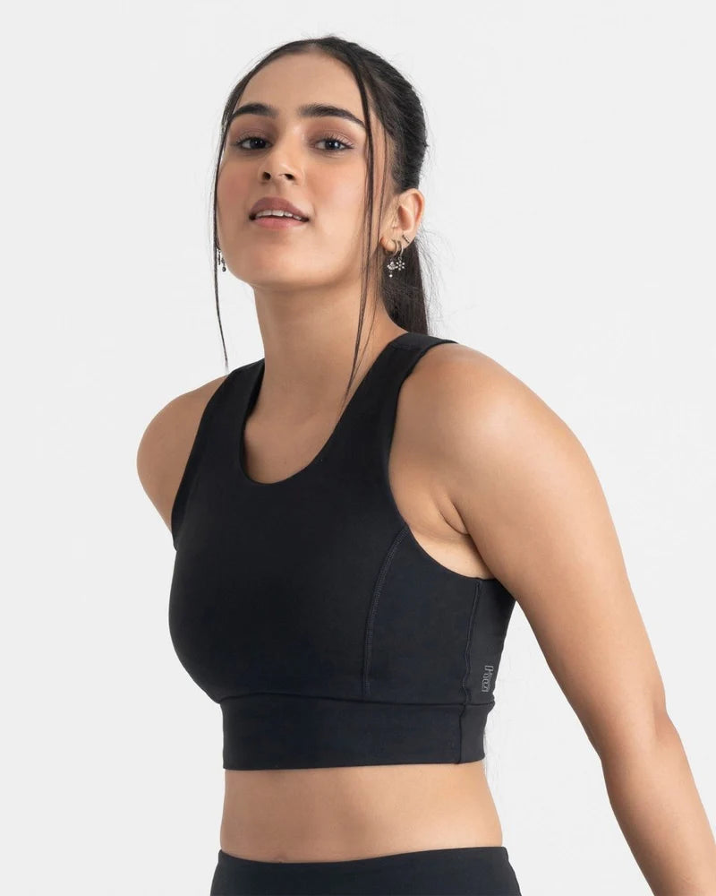 women wearing a black sports bra/crop top