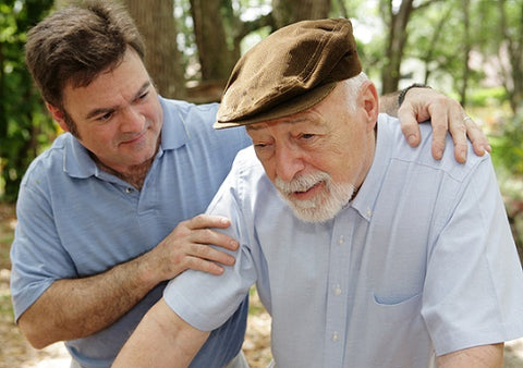 man helping dementia patient