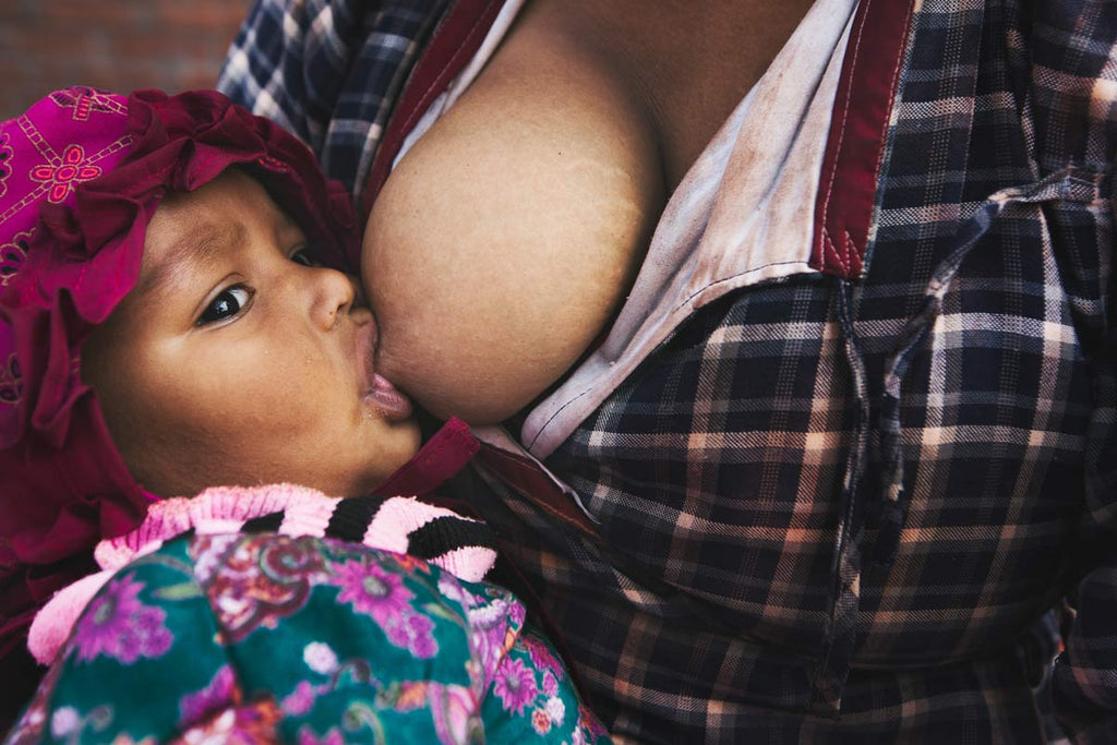 close up child breastfeeding