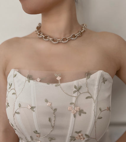 Chunky chain necklace with strapless floral corset style top