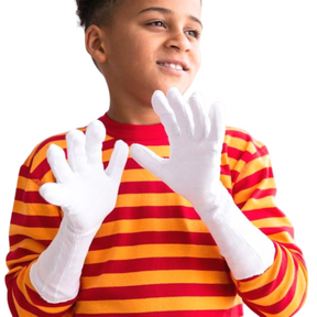 Boy in red and yellow striped pajamas wearing white organic cotton gloves for kids.