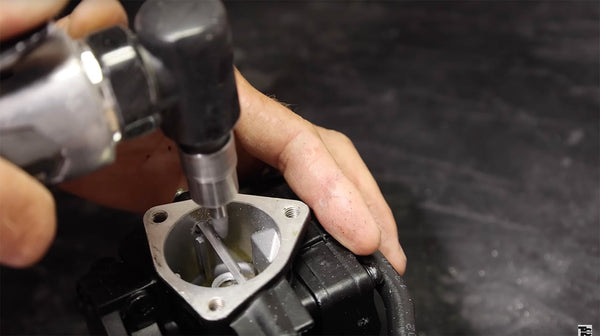 filing down screws inside carburetor