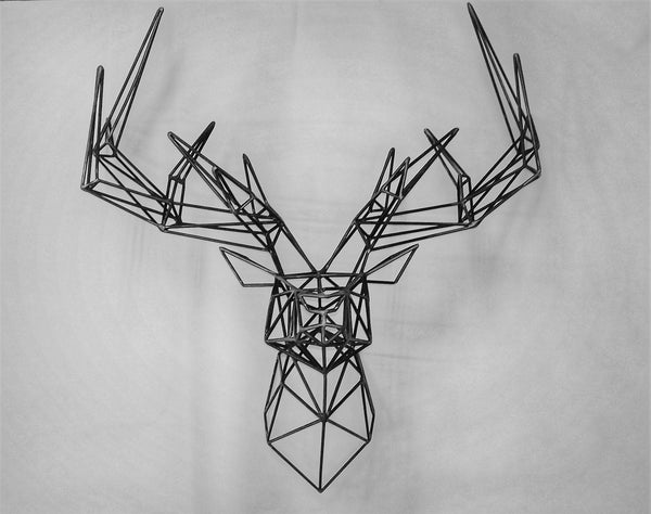Adorn your walls with this geometric deer head wall art, handcrafted from metal with precision and care. Its contemporary design is composed of interconnected metal rods that form the majestic shape of a deer, resulting in a three-dimensional piece that captures the light and shadow in your room. This wall art is a modern take on wildlife sculptures, bringing a touch of nature's nobility to your urban space.