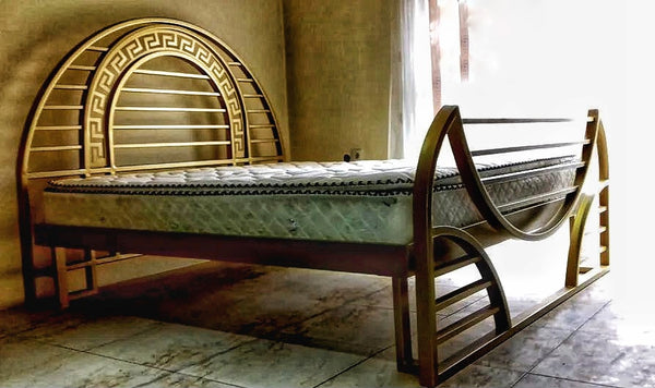 Transport your bedroom back to the glamour of the Art Deco era with this luxurious bed frame. The handcrafted metal side rails and footboard boast intricate designs, while the grand headboard makes a statement with its unique geometric patterns. Every detail is a nod to the craftsmanship of yesteryears, yet with the strength and durability for today's lifestyle.