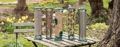 Peckish All Weather Bird Feeders filled with bird feed