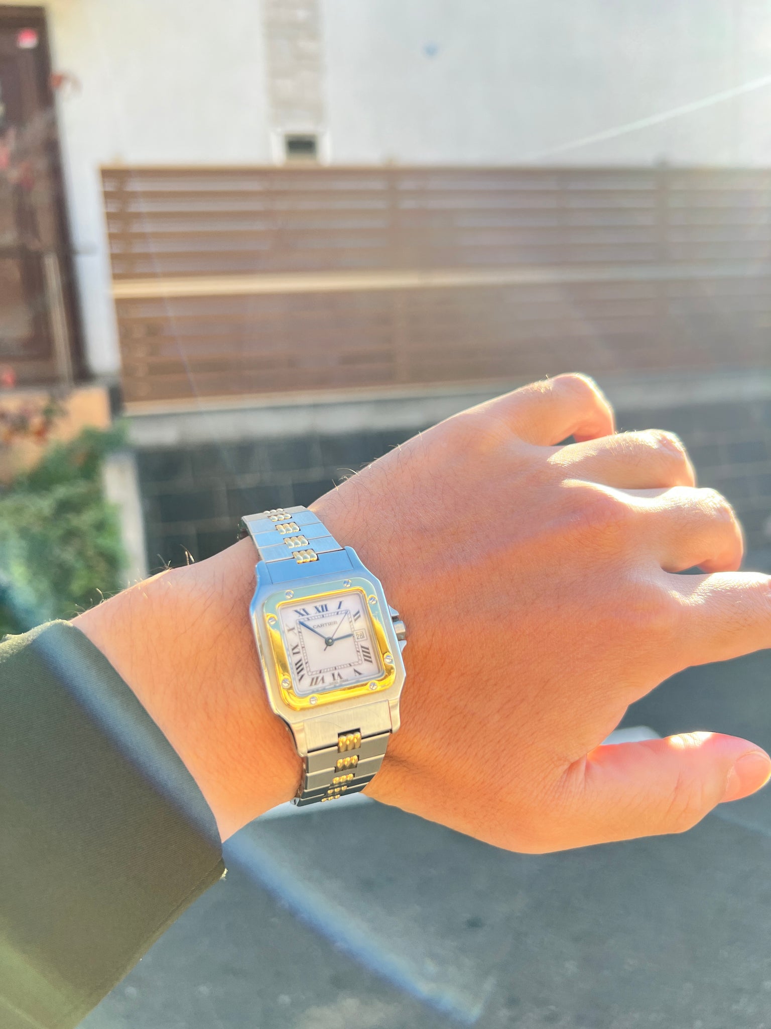 A photo of a vintage Cartier watch, the Santos Galbee, with a gadroon bracelet