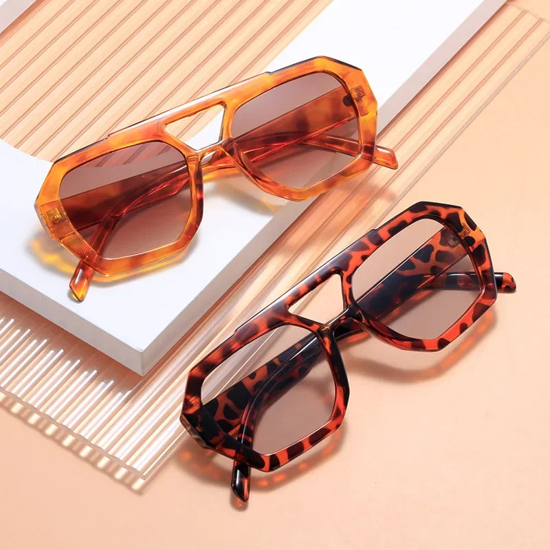 color lineup of oversized square sunglasses in black tortoise brown amber blue and rose