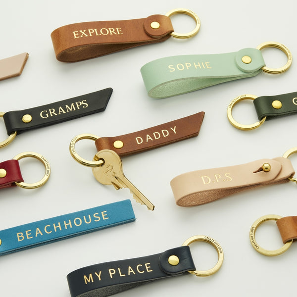 A group of colourful leather keyrings personalised with various example names