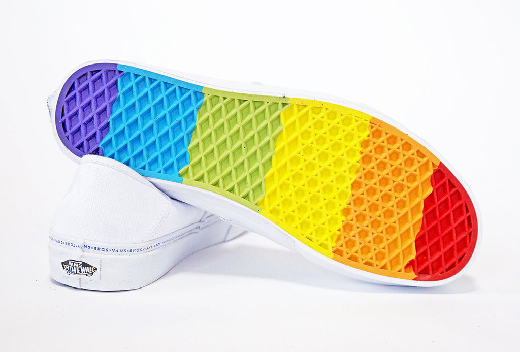 white slip on vans with rainbow bottom